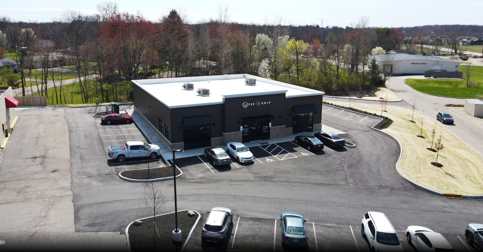 aerial view of building and parking lot
